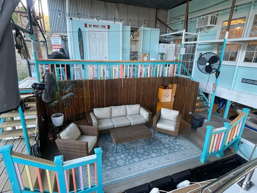 a view of living room kitchen and deck