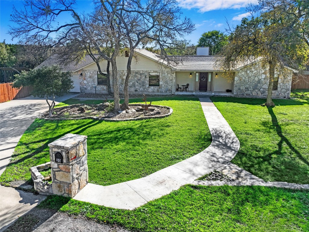 a view of a house with a yard porch and sitting area