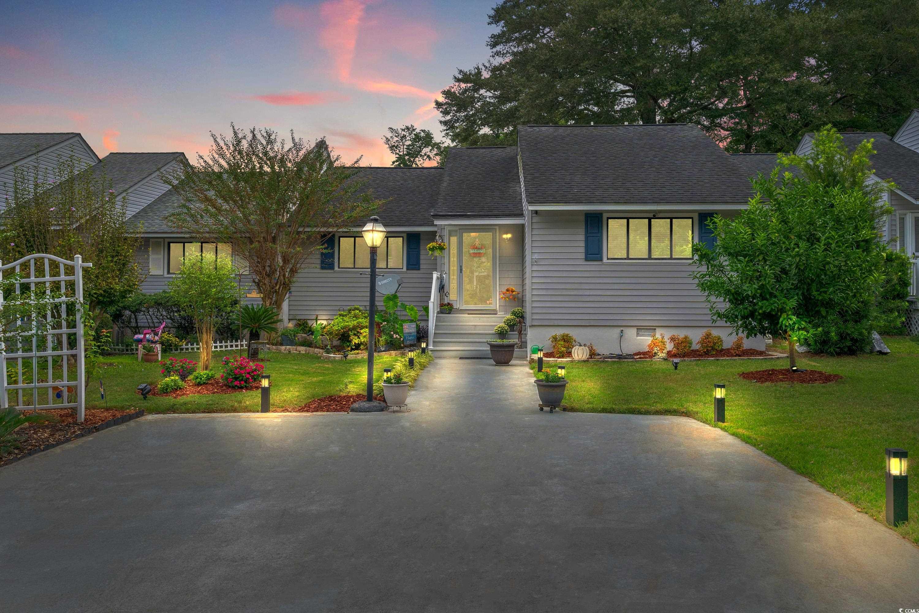 Ranch-style home with a lawn