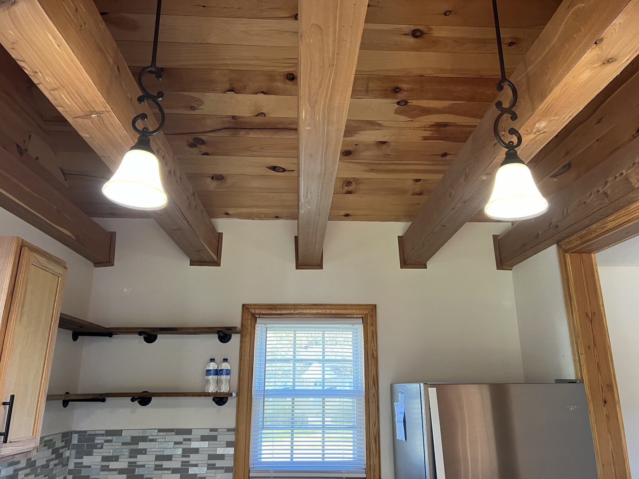 Modern but Rustic Kitchen with wood ceiling and wood beams.