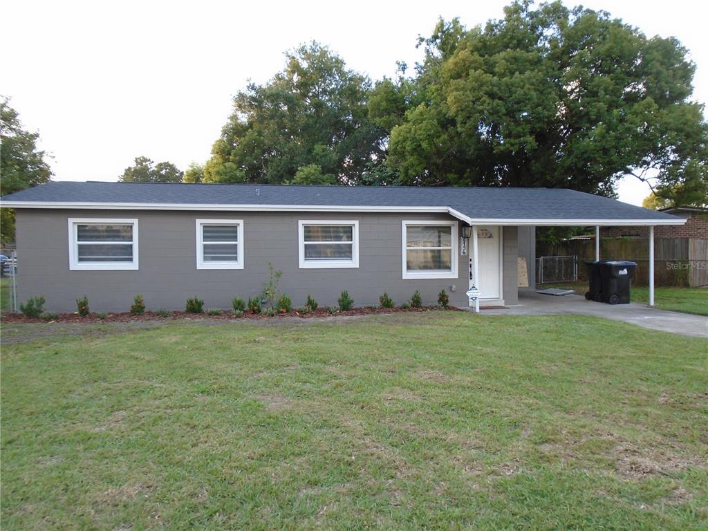 front view of a house with a yard