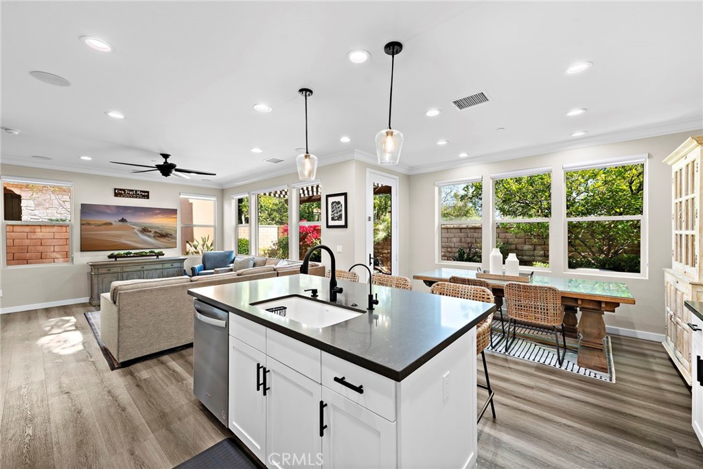 a kitchen with counter space and windows