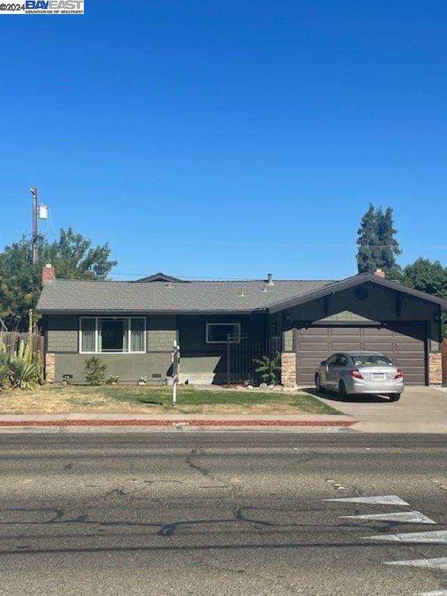 a view of a car parked in front of a house