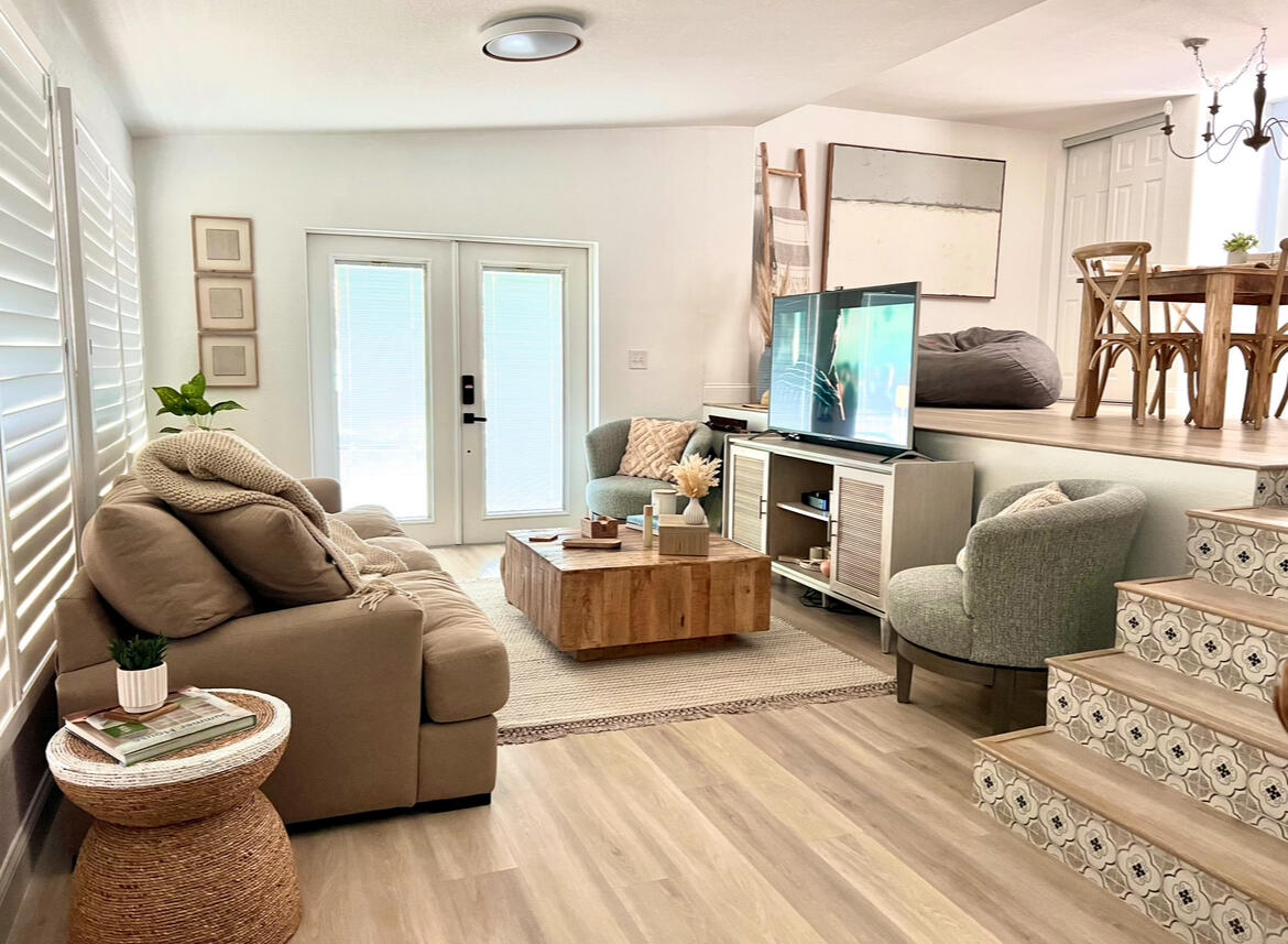 a living room with furniture and a large window