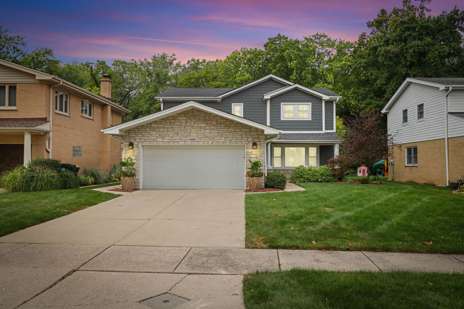 a front view of a house with a yard