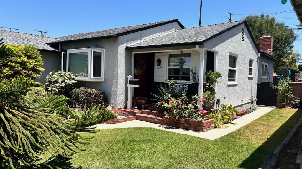 a front view of a house with yard