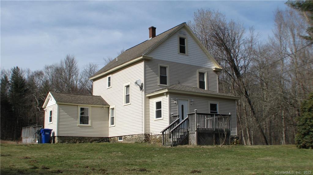 EXTERIOR FRONT - SOUTH WEST CORNER.