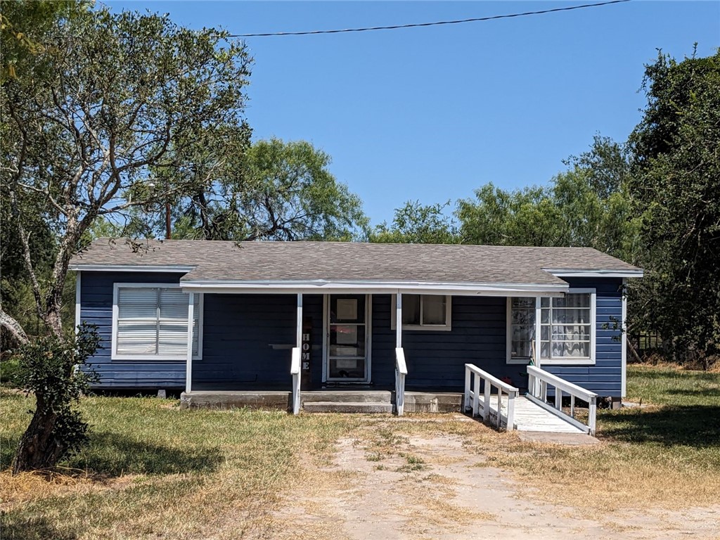 a house with trees in the background