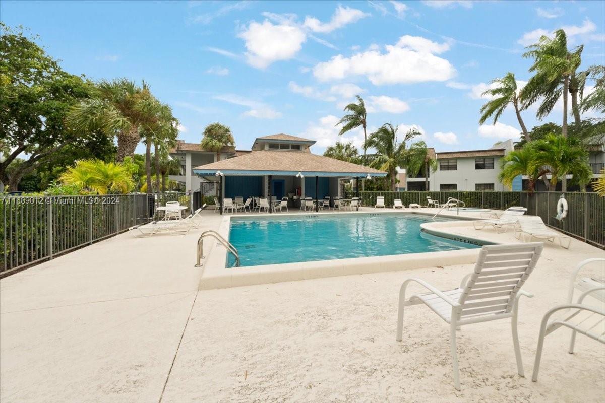 a view of a swimming pool with a patio