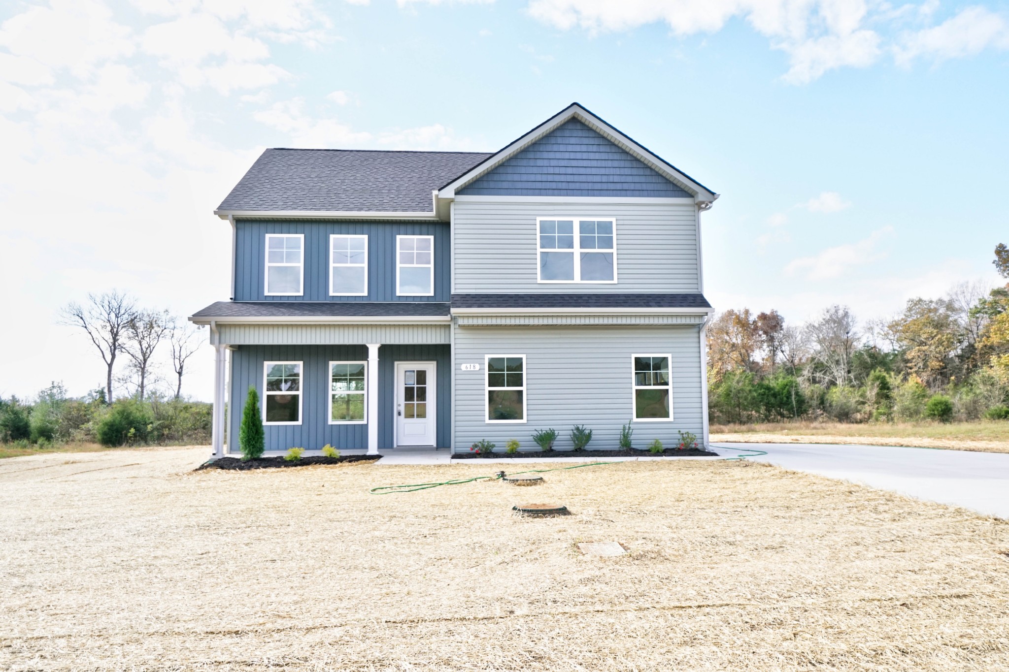 a front view of a house with a yard