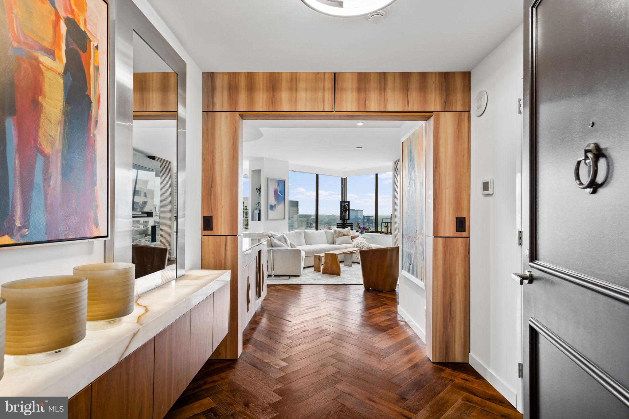 a large living room with a large mirror and a table