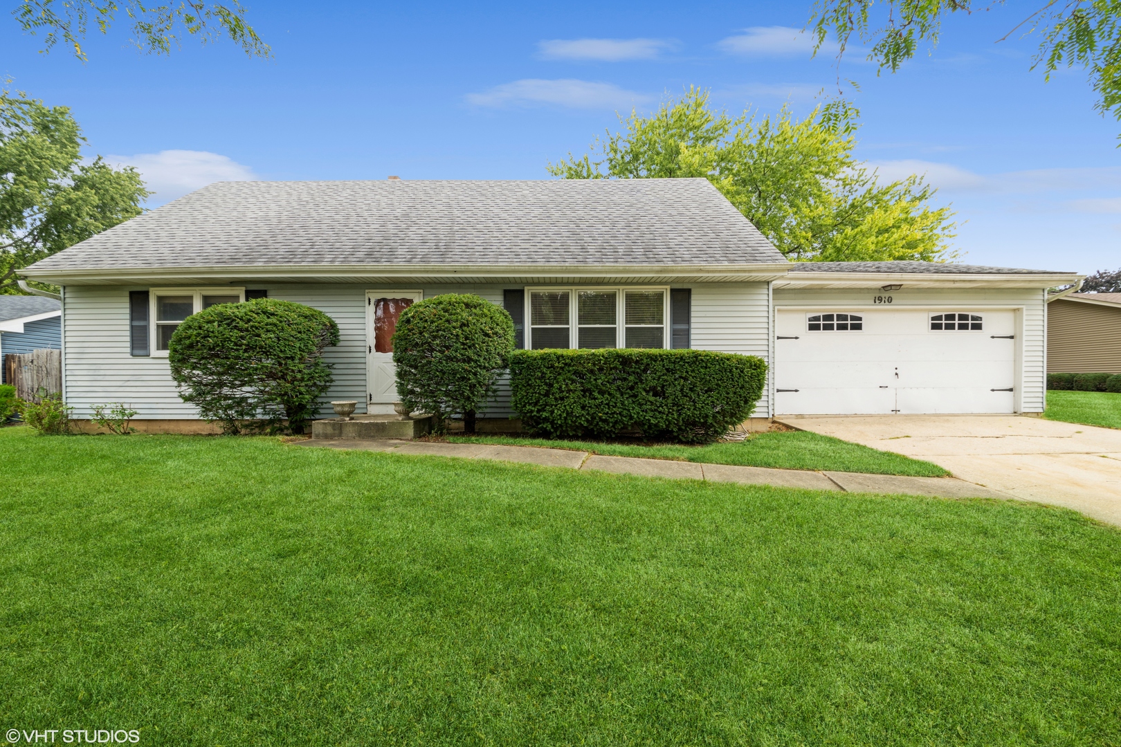 front view of a house with a yard