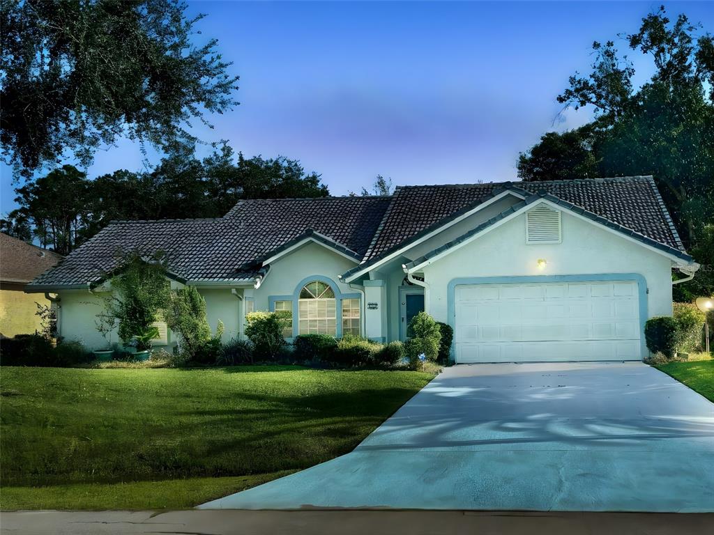 a front view of a house with a yard