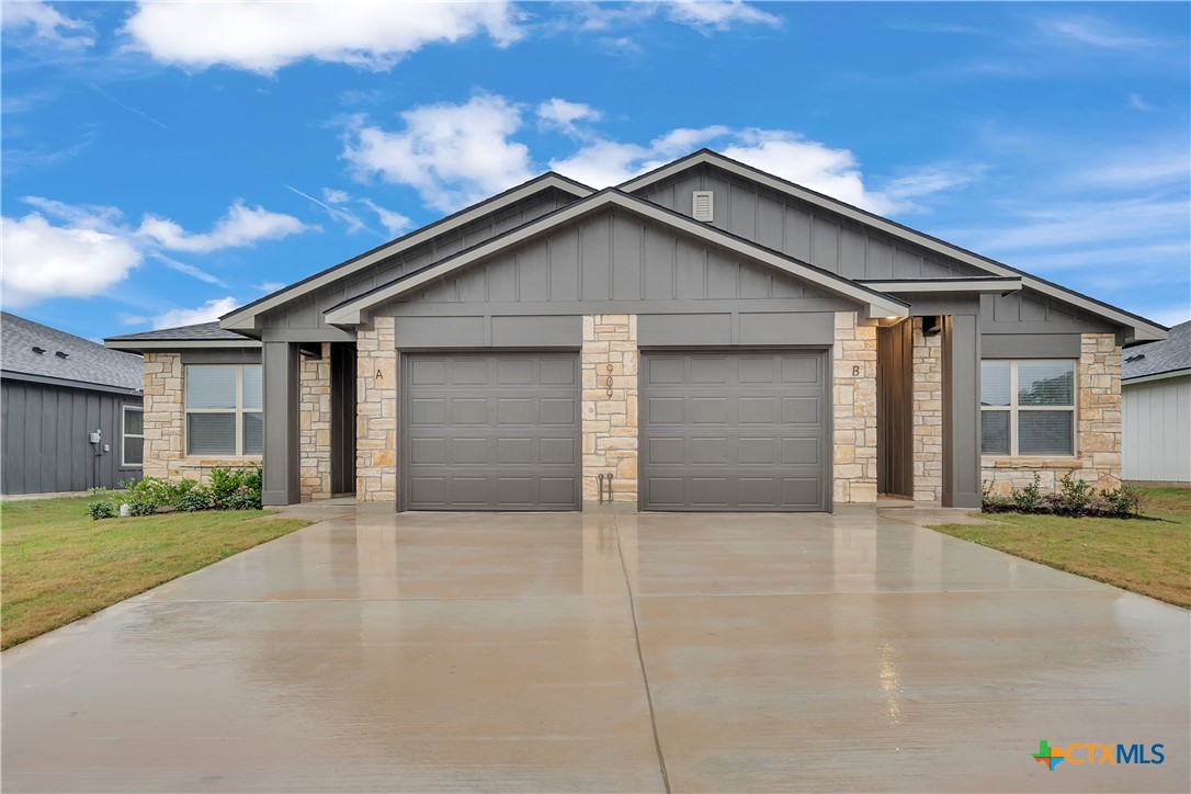 a view of house with garage and