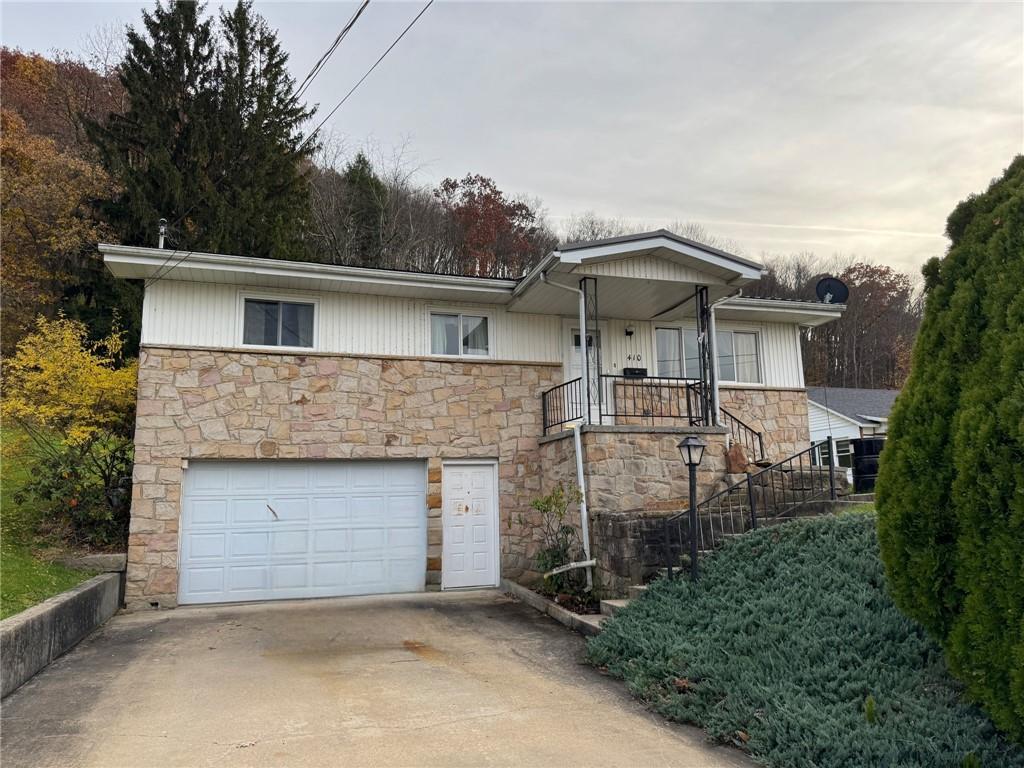 a front view of a house with garage