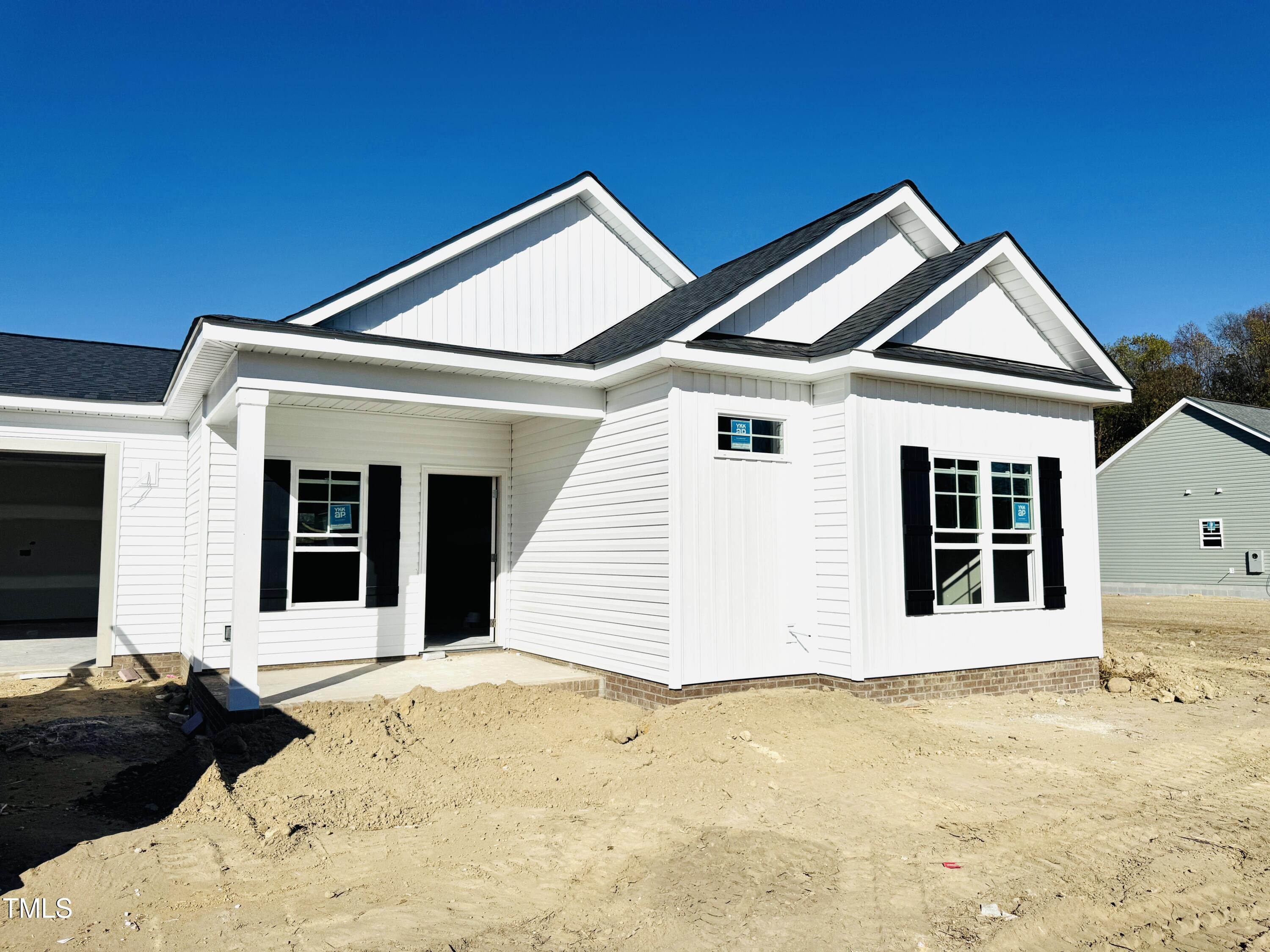 a front view of a house with a outdoor space