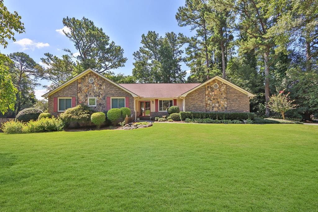 a front view of a house with garden