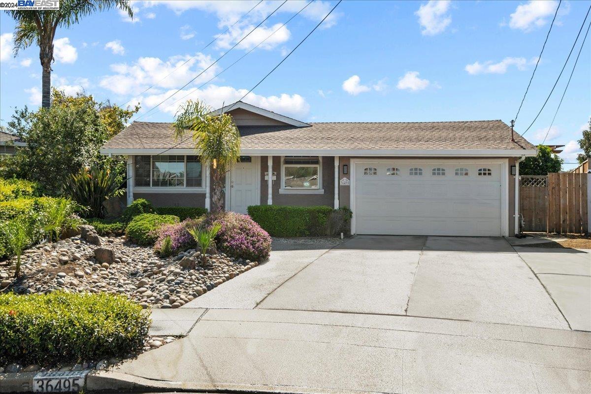 a front view of a house with a garage