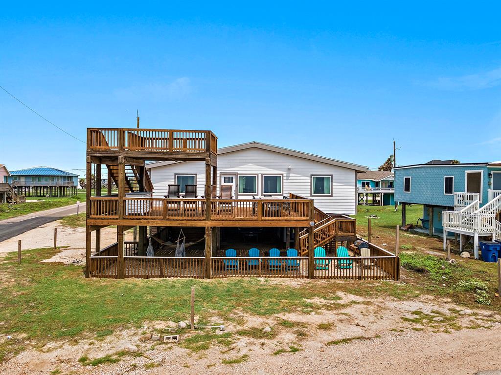 a front view of a house with a yard table and chairs