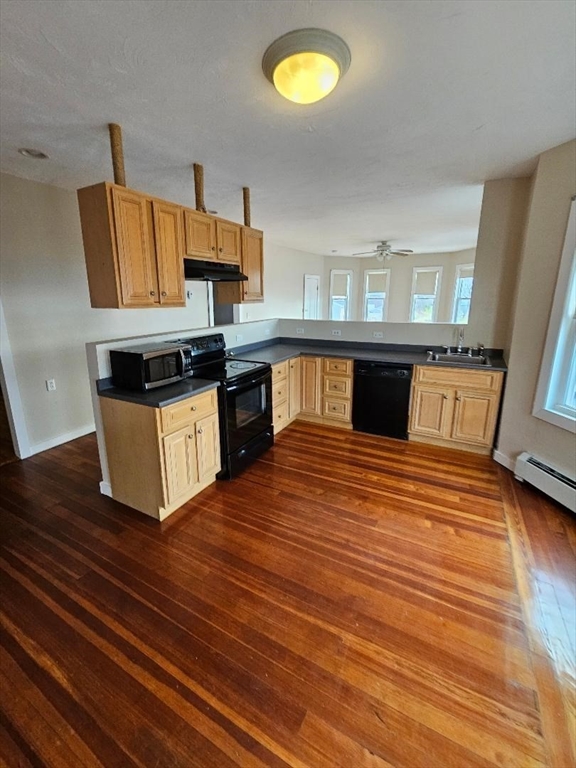 a kitchen with stainless steel appliances granite countertop a sink and stove top oven