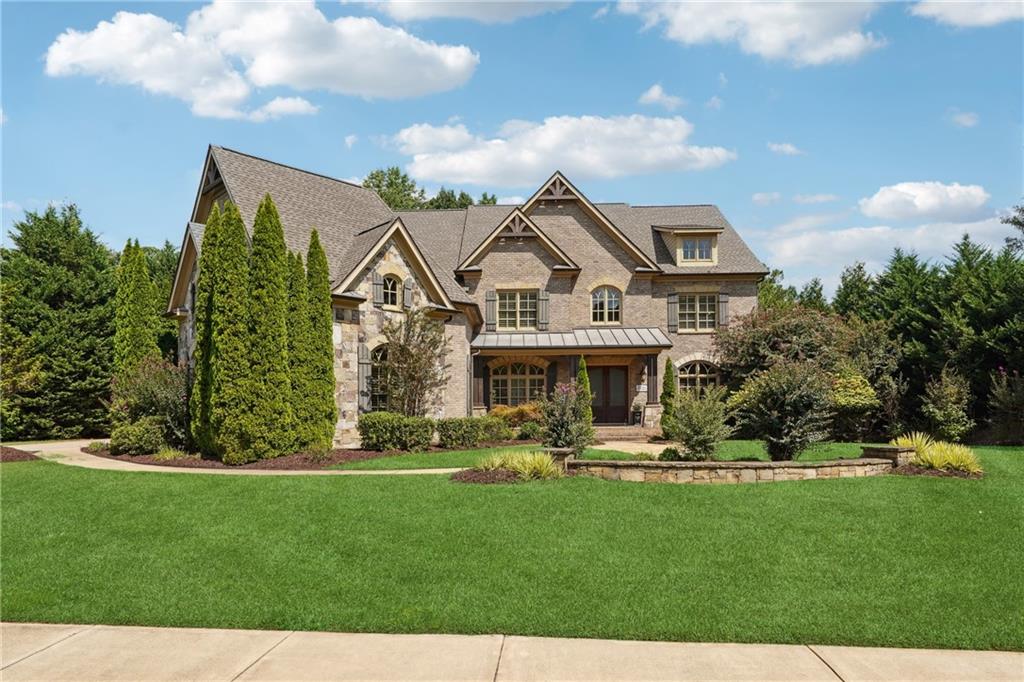 a front view of a house with a yard