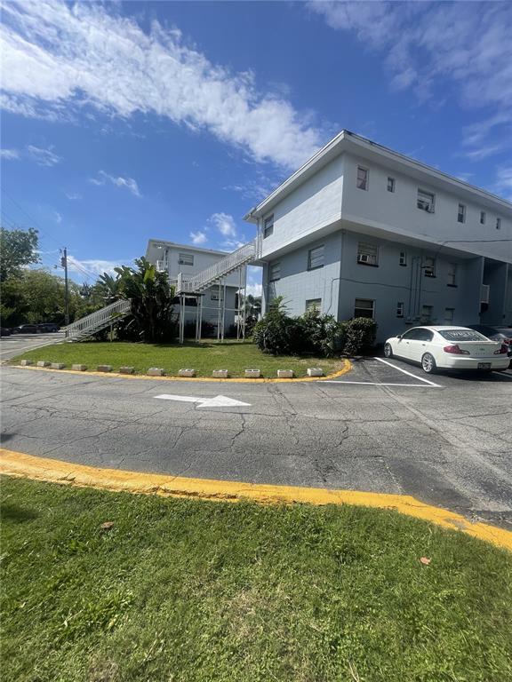 a view of a building with a yard