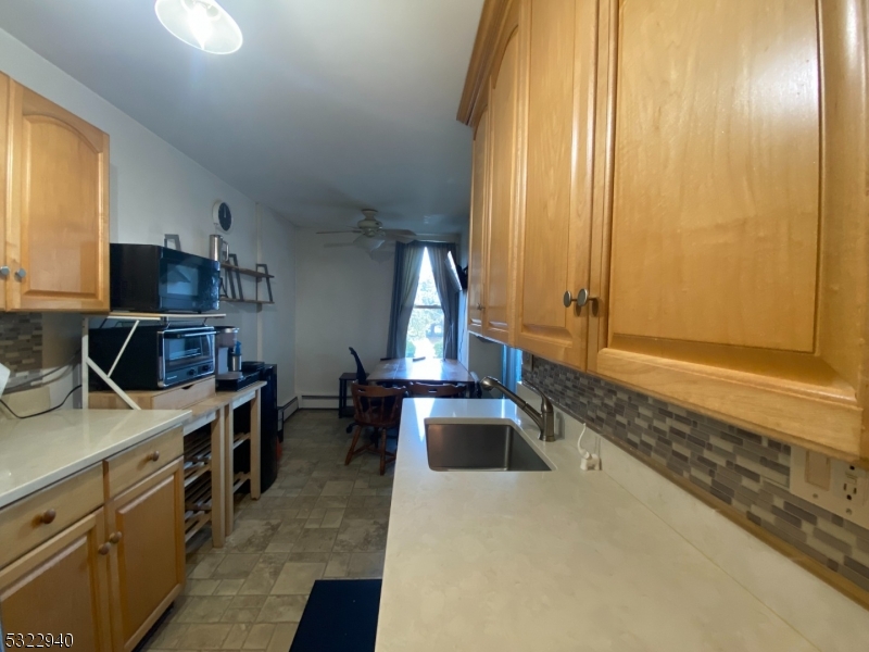 a kitchen with a stove a sink and a microwave