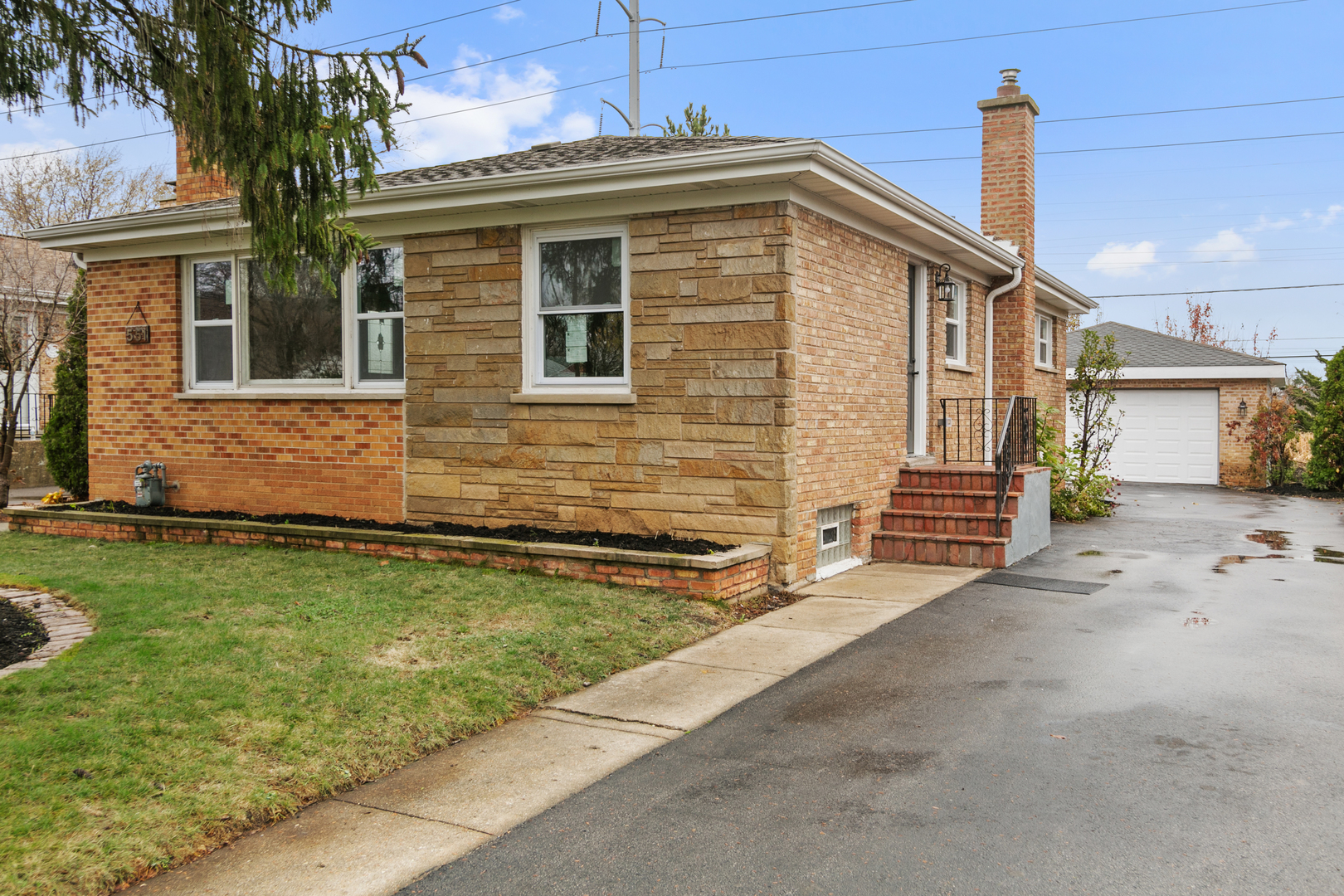 a front view of a house with garden