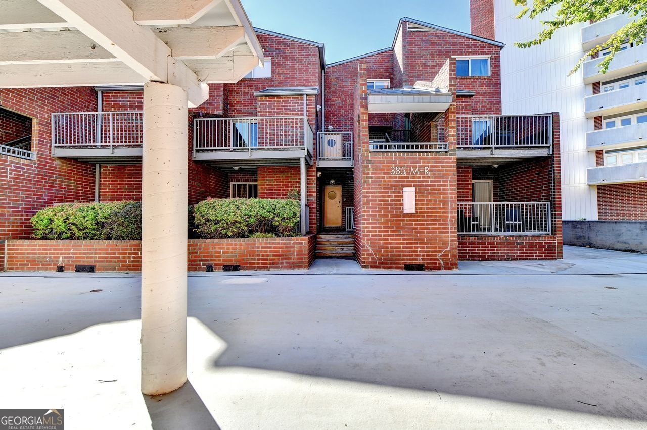 a front view of a building with a road