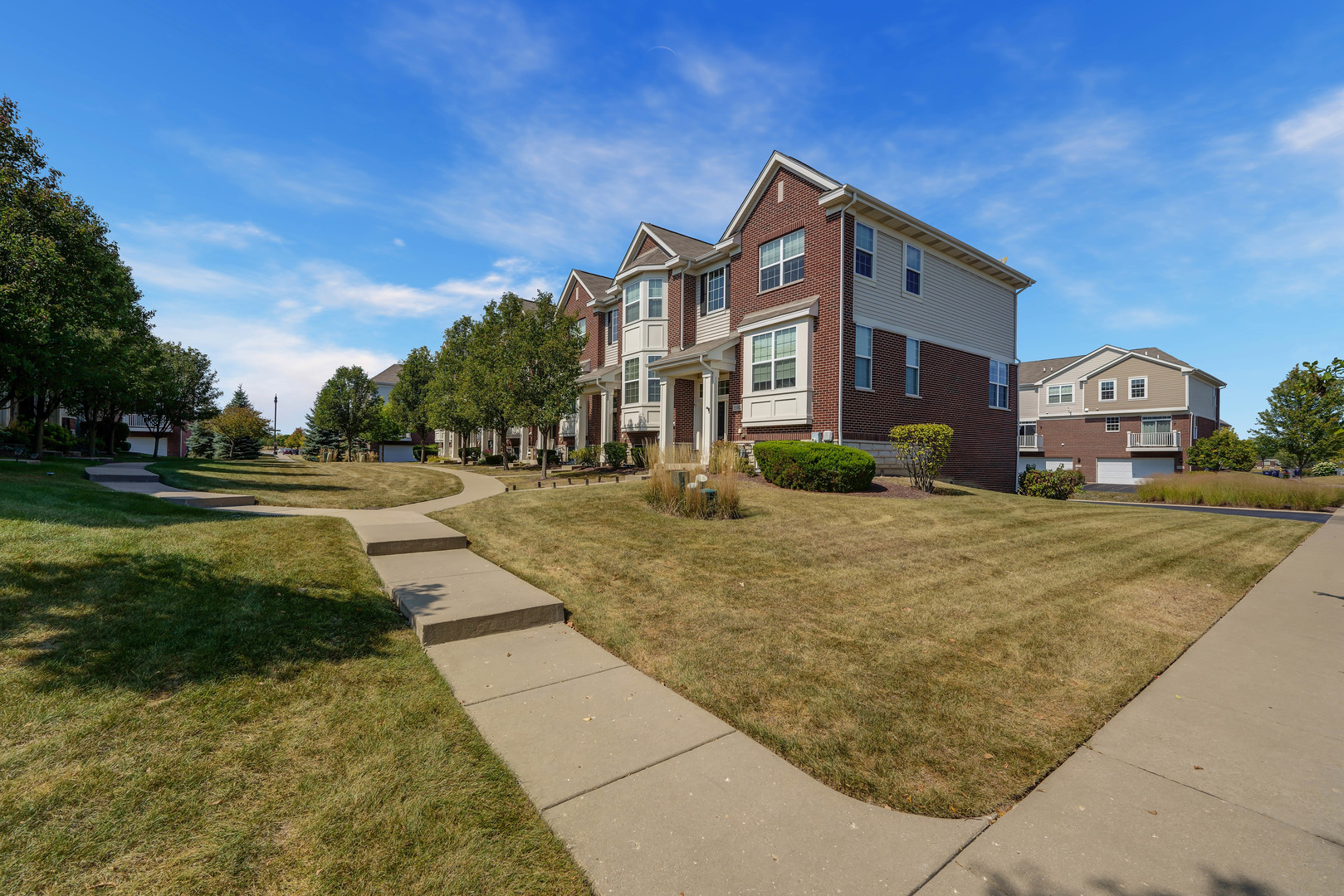 a view of multiple houses with a yard