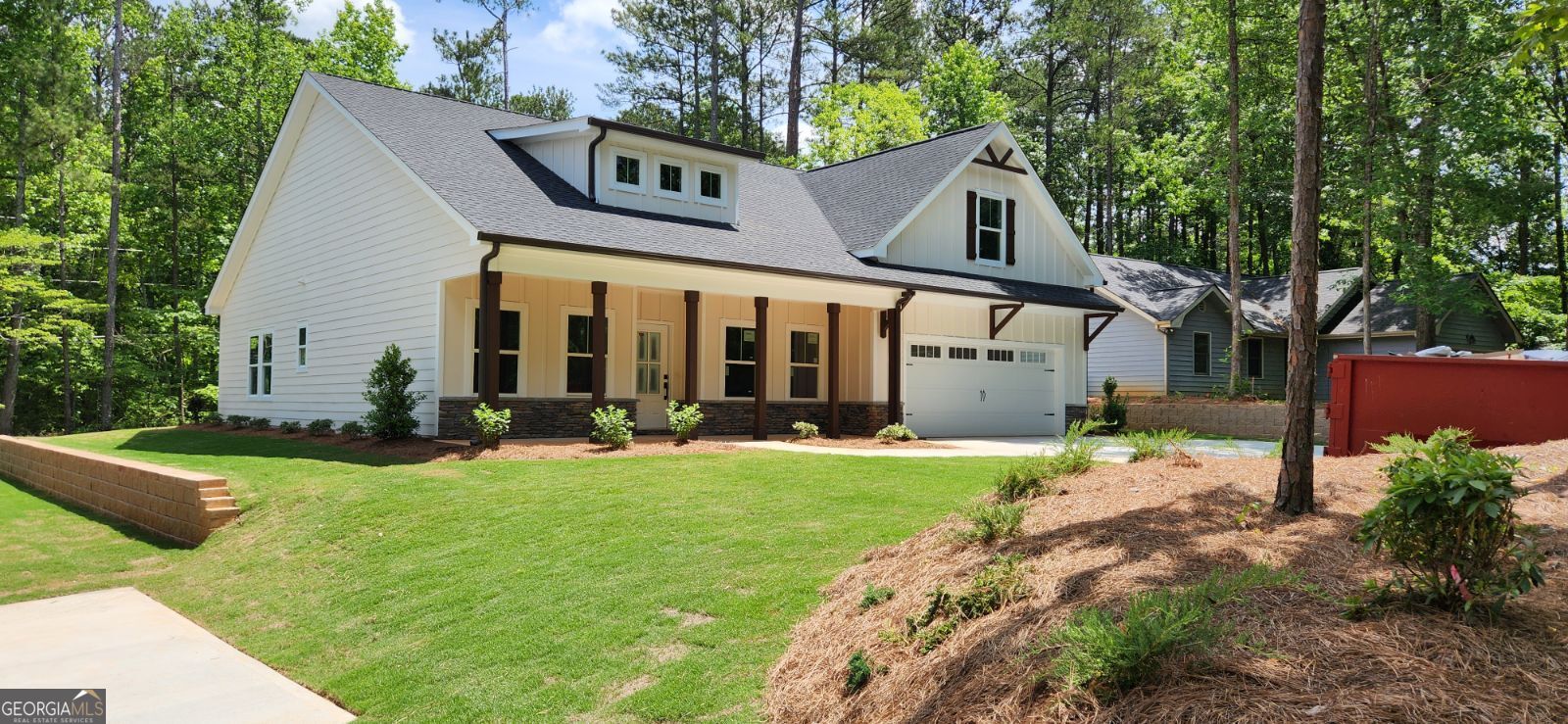 a front view of a house with garden