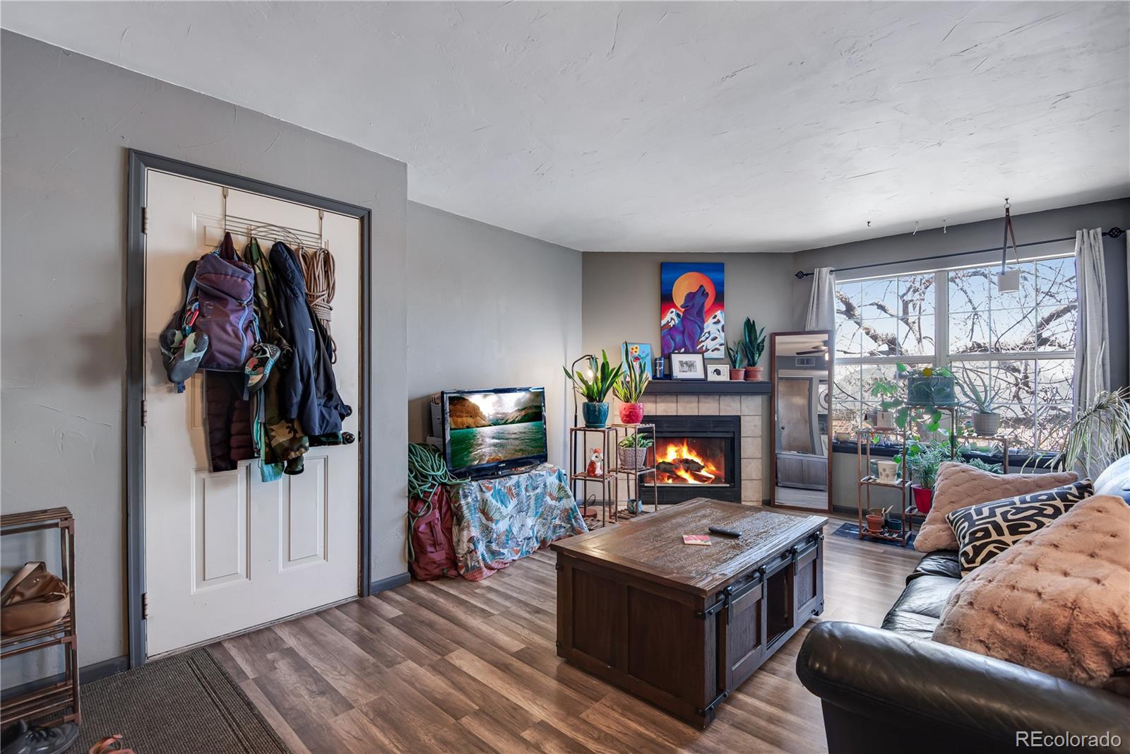 a living room with furniture and a flat screen tv