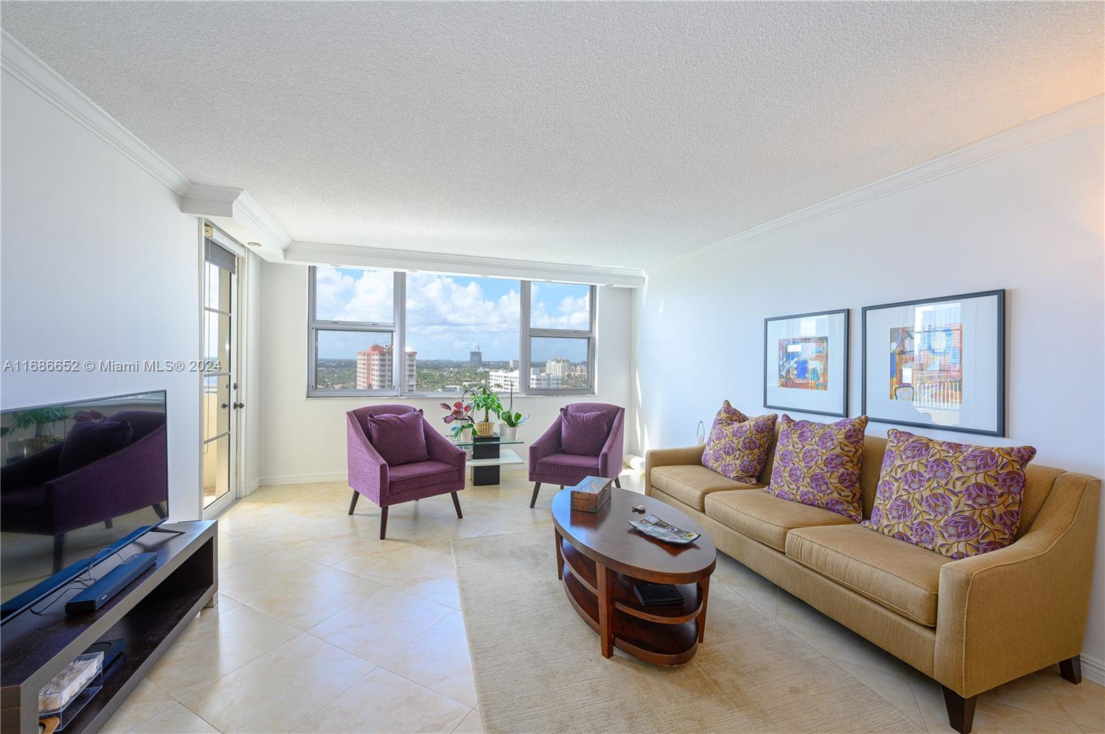 a living room with furniture flat screen tv and a fireplace