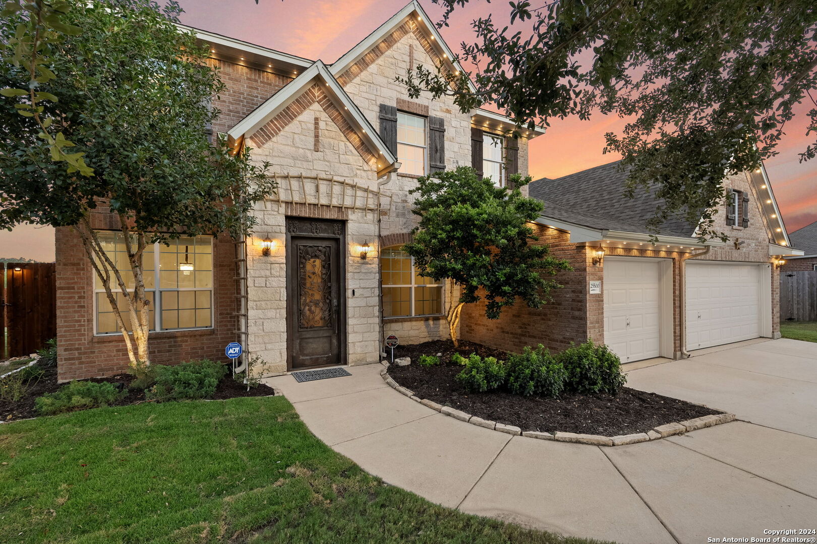 a front view of a house with garden