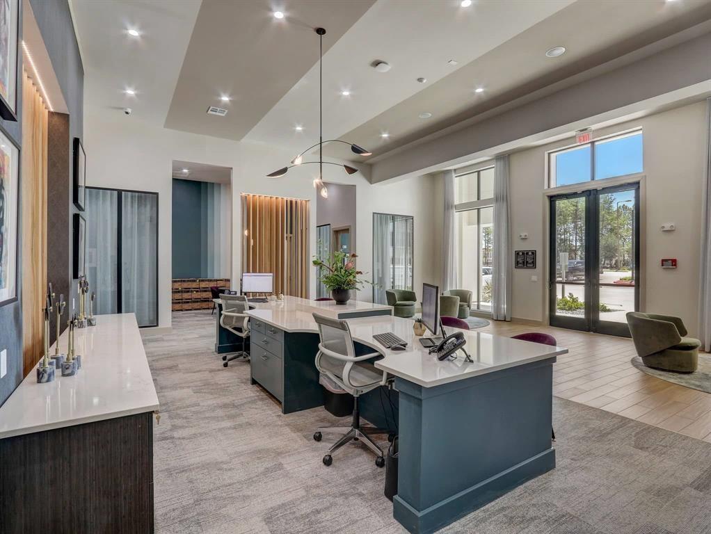 a living room with stainless steel appliances kitchen island granite countertop a couch and a view of living room