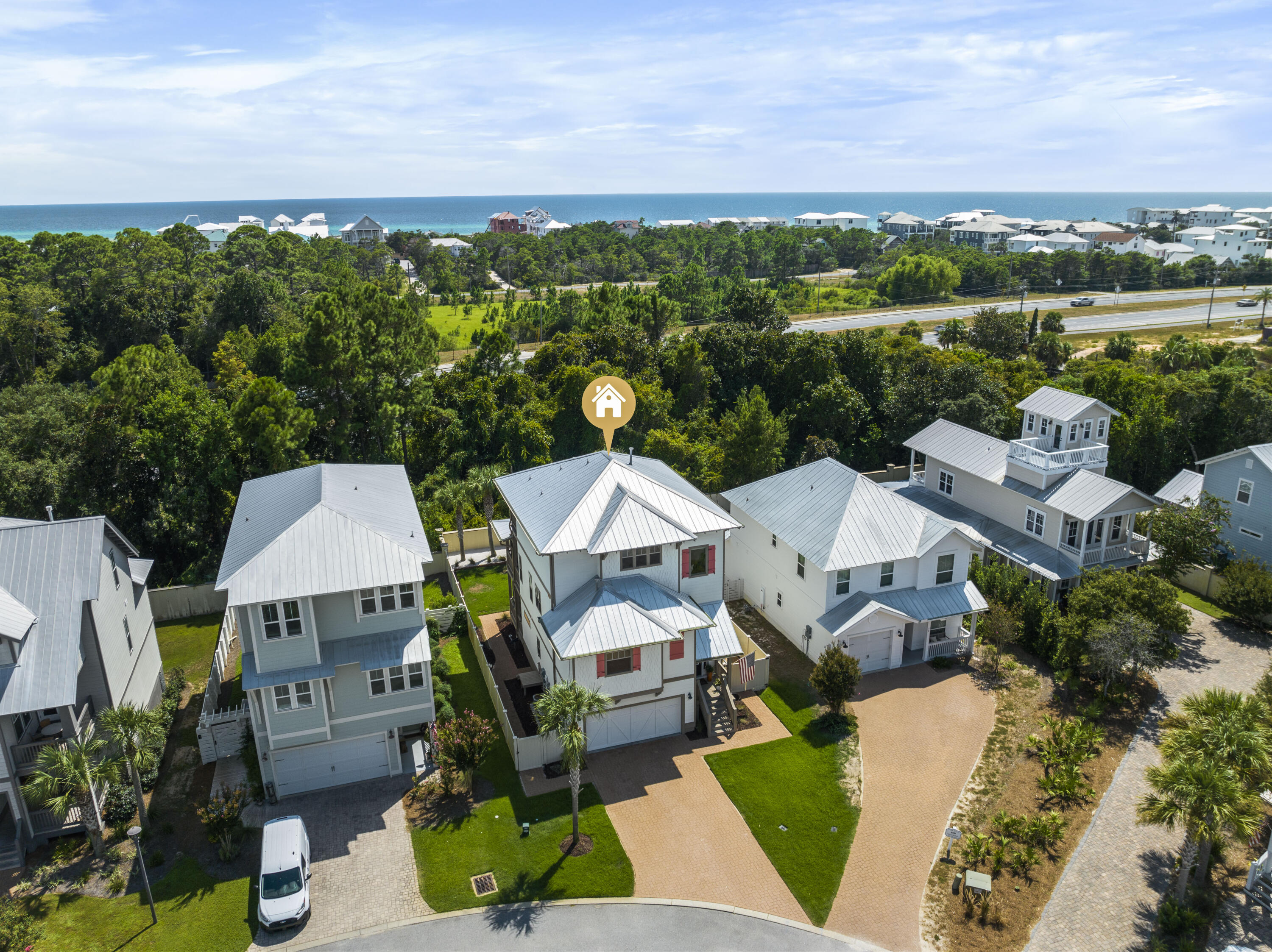 an aerial view of a house with a garden