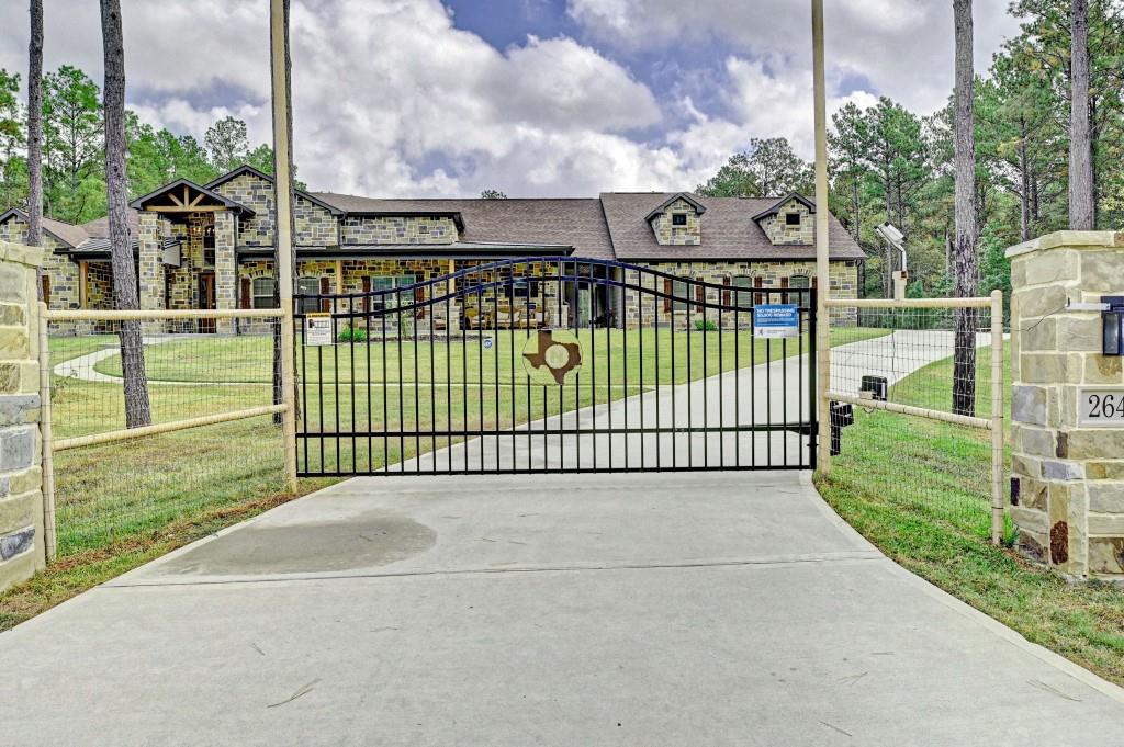 a view of a backyard with a wooden fence