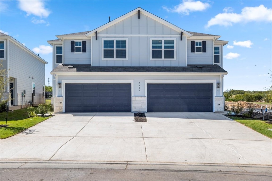 a front view of a house with yard