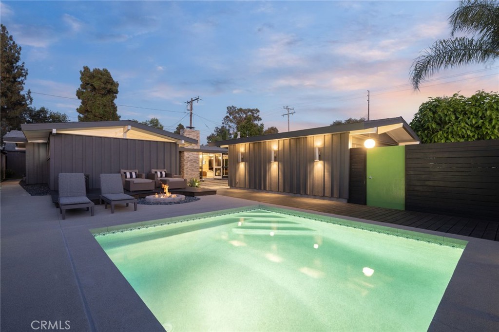 a view of a backyard with plants and a patio