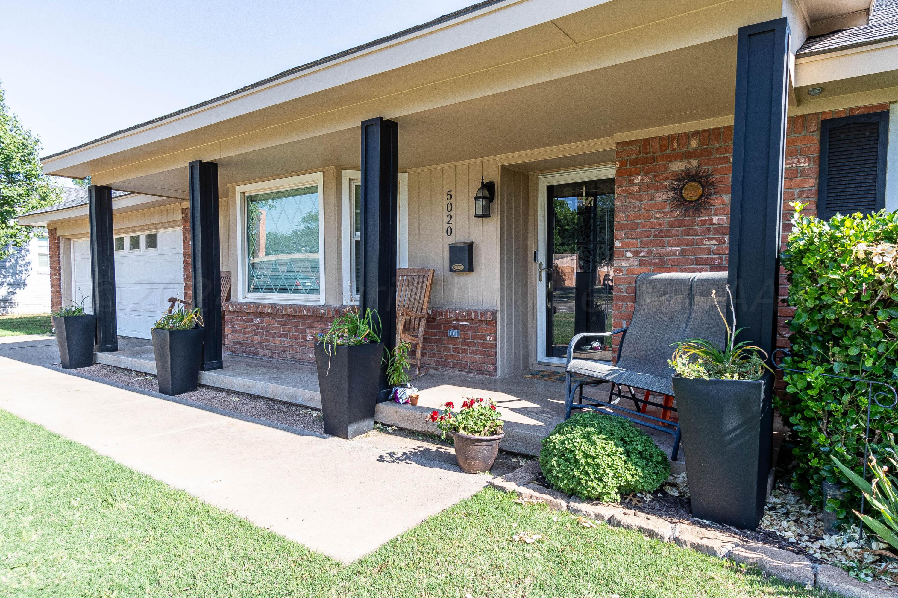 a house view with a garden space