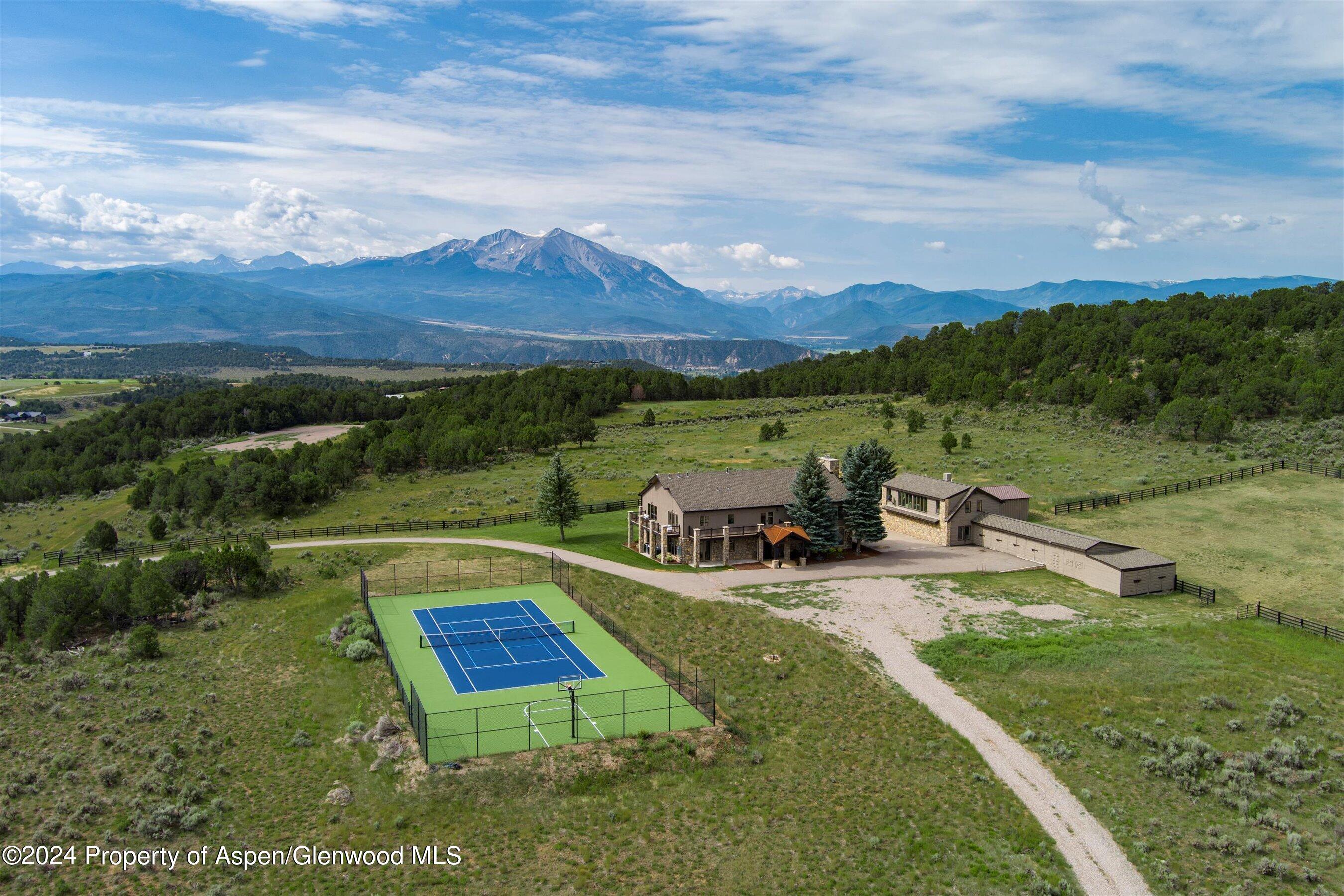 a view of a swimming pool with a yard