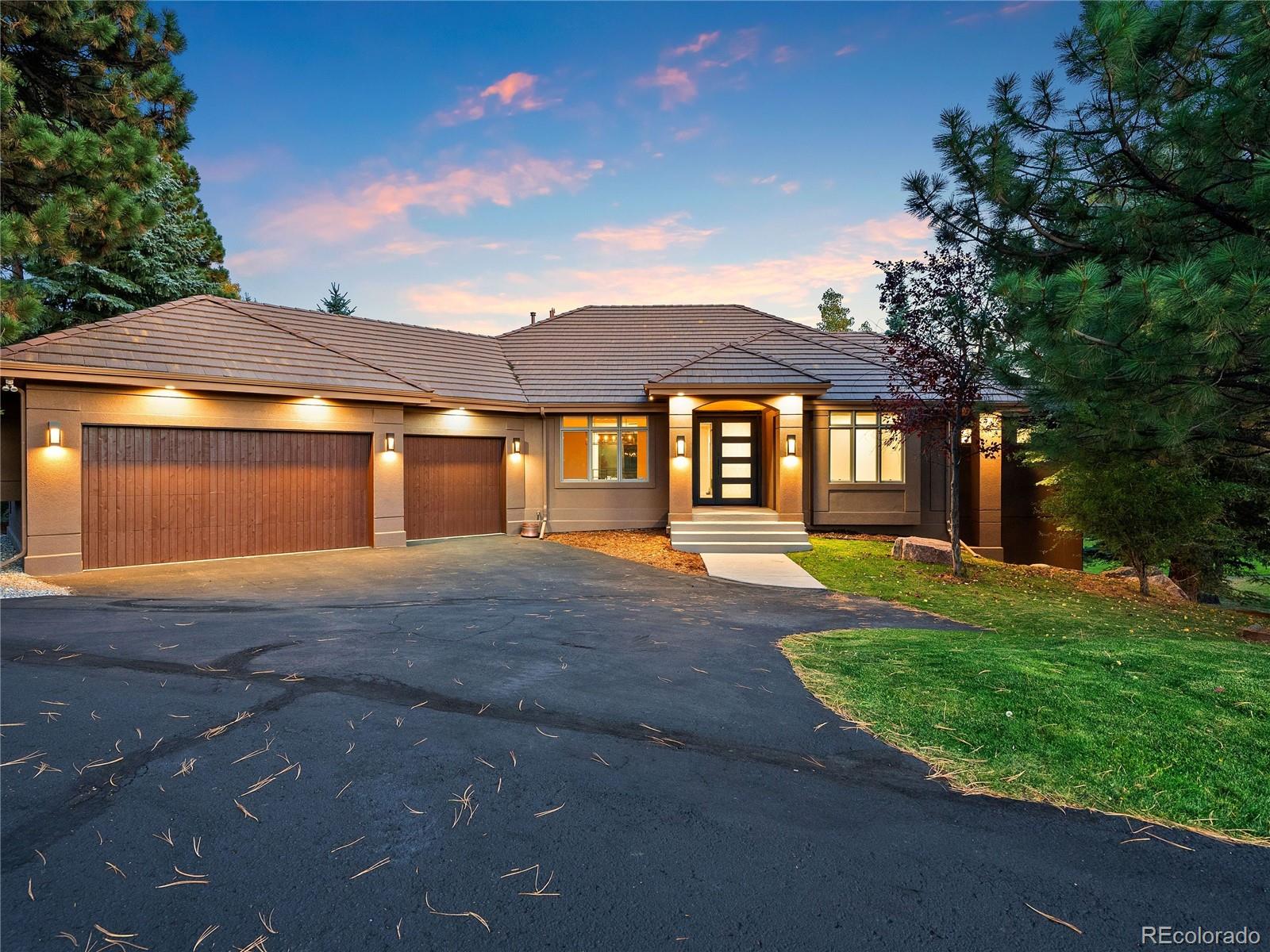 a front view of a house with yard