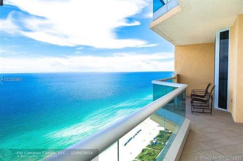 a view of an ocean from a balcony