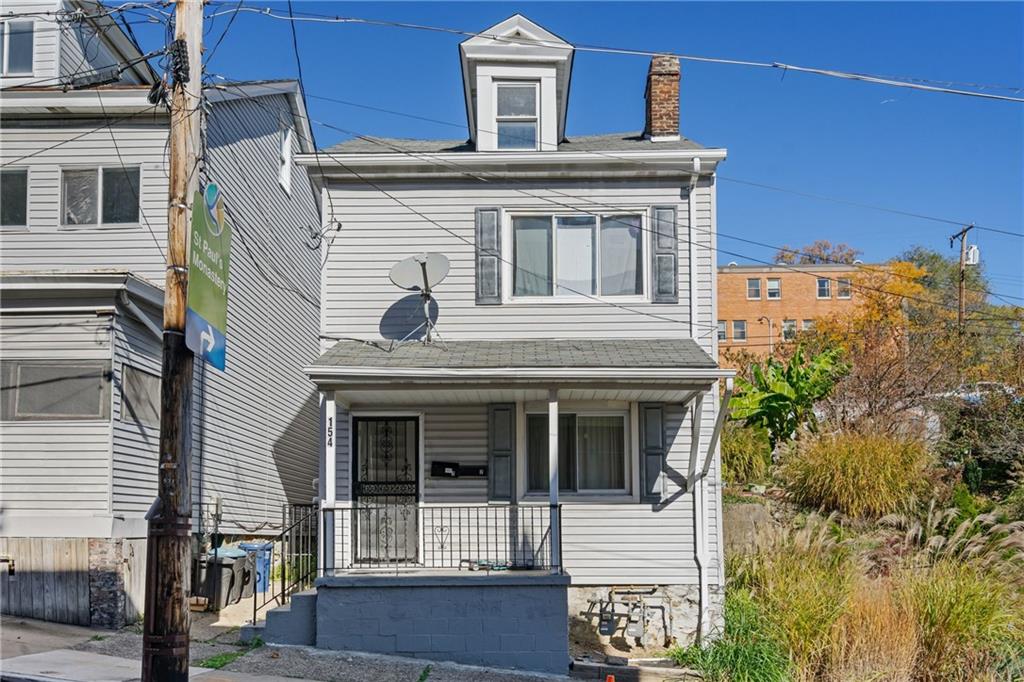 front view of a house with a small yard