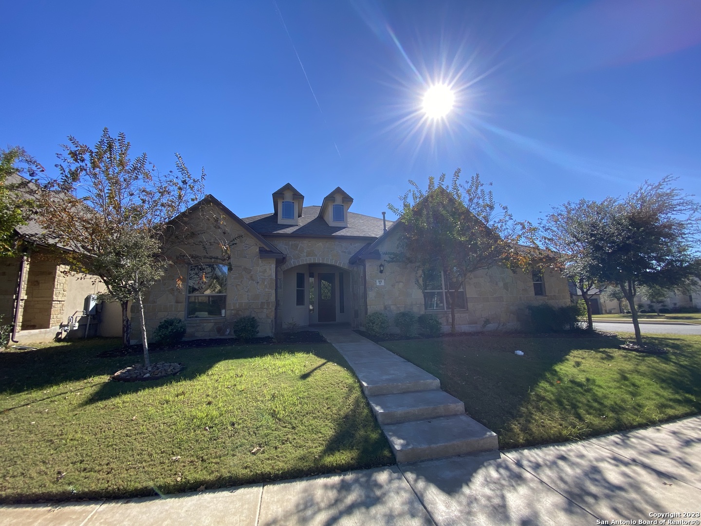 a front view of a house with a yard