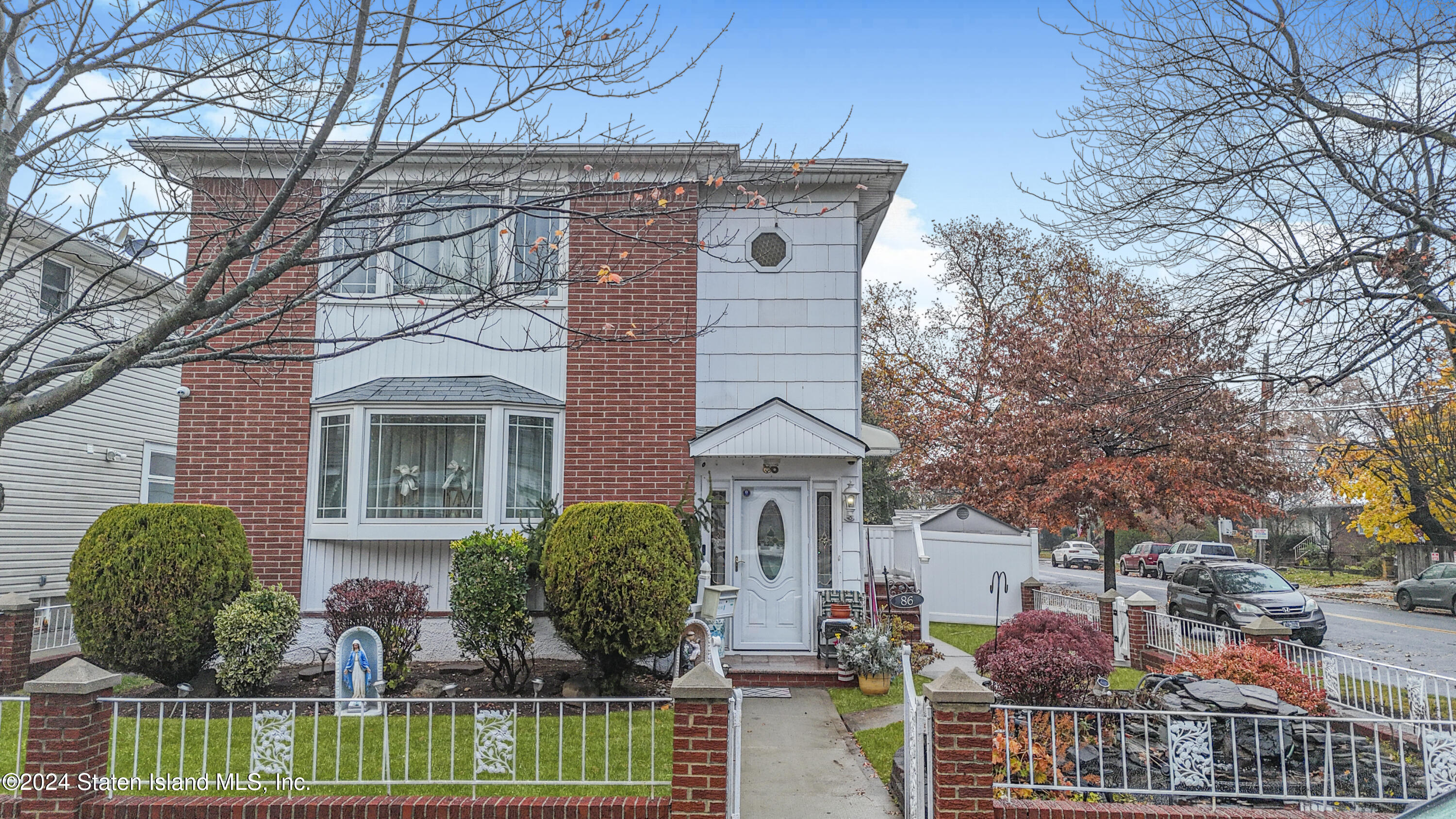 front view of a house with a garden