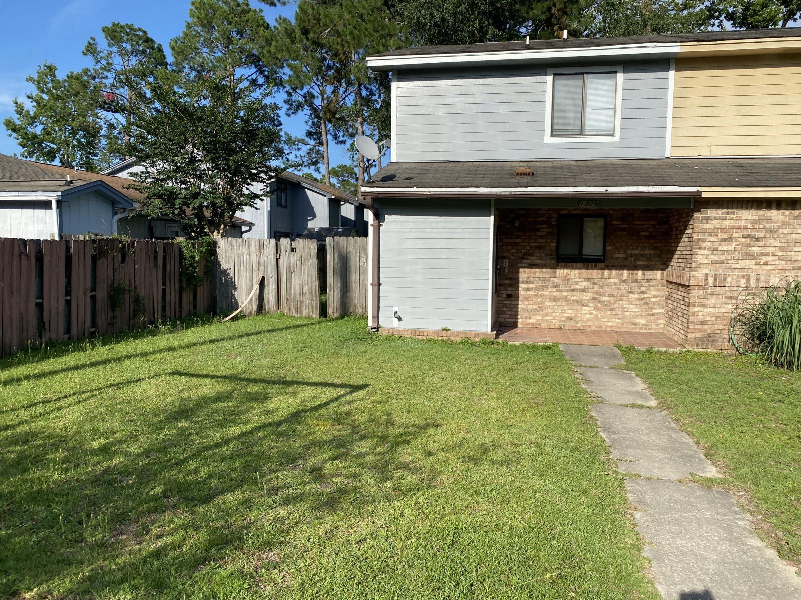 a view of a house with a yard