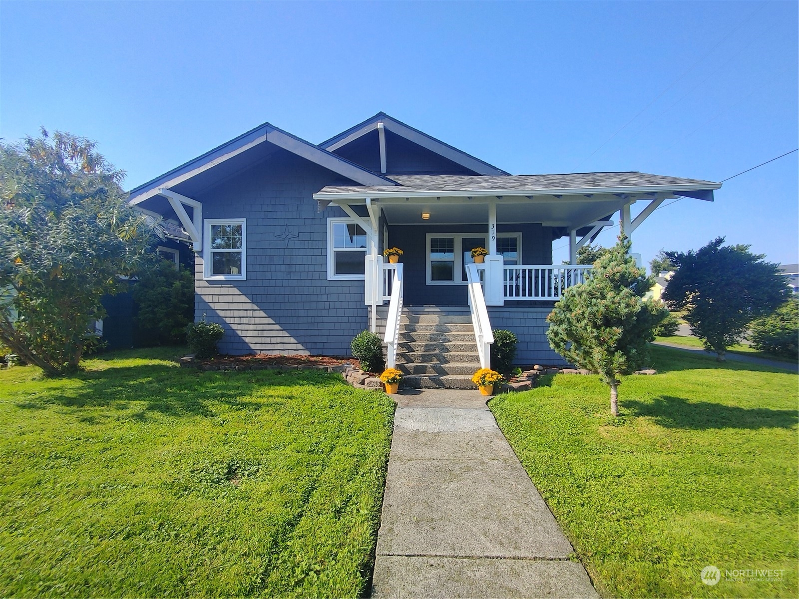 a front view of a house with a yard