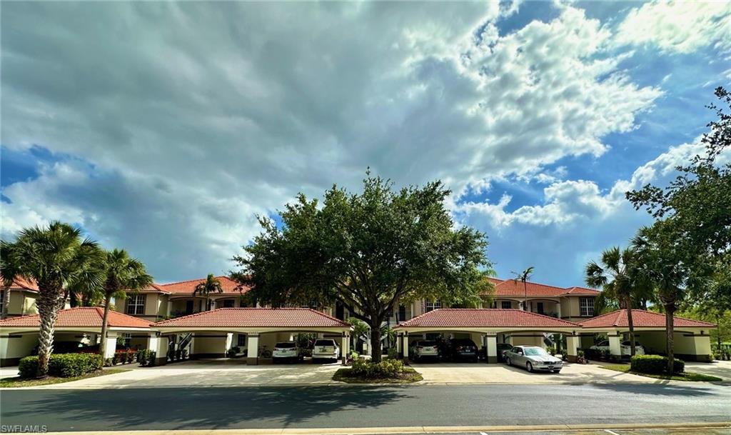 a front view of building with yard