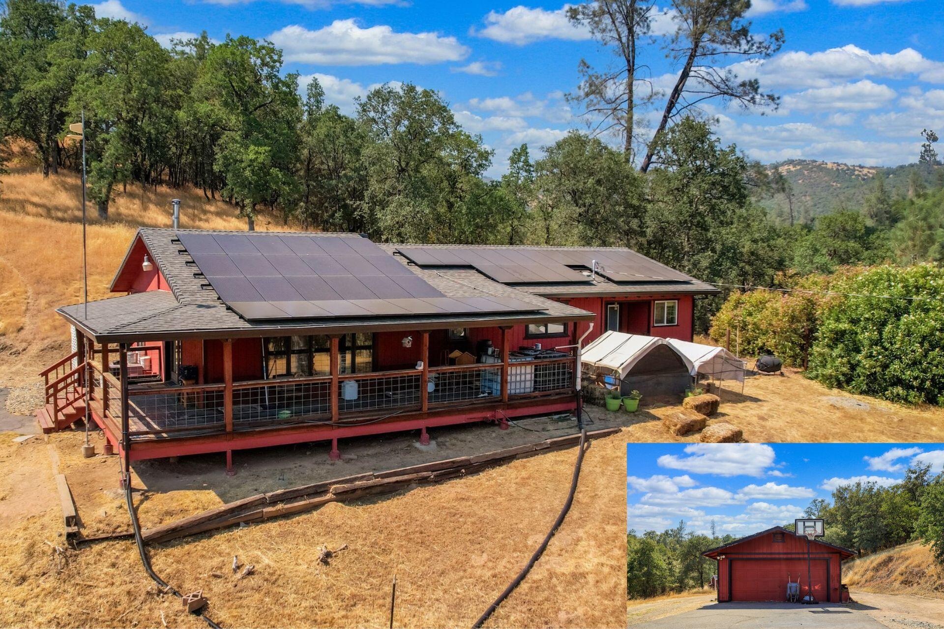 a view of a house with roof deck outdoor seating